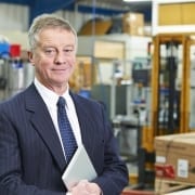 Man standing in warehouse of products